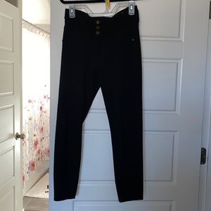 Black jeggings with three buttons and zipper and pockets